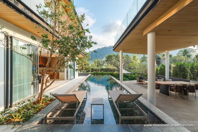 Curved Architectural Villa with Private Garden Spaces