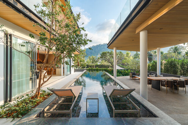 Curved Architectural Villa with Private Garden Spaces